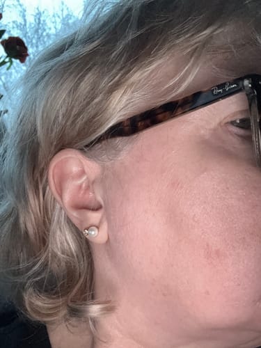 Customer wearing the elegant Classic Pearl Stud earring in their ear.