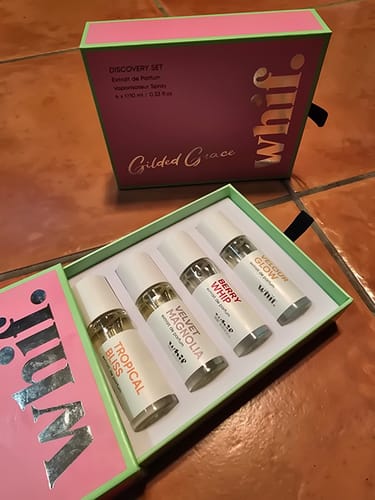 Reviewer's open Discovery Set sample box, showing the four included fragrance bottles.