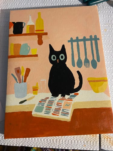 Customer's completed mini painting of a black cat on a newspaper in a kitchen, from the 6-painting set.