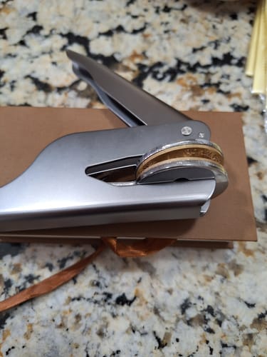 Customer photo review of Premium Embosser Packaging