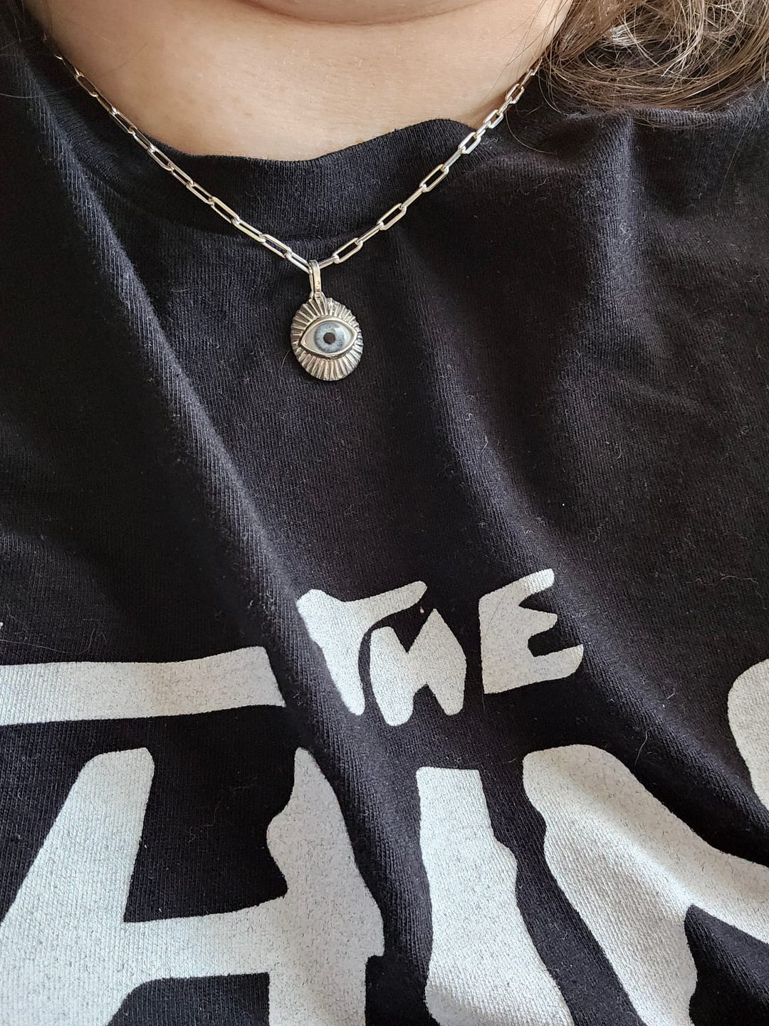 Customer photo review of Mini Starburst Eye Pendant