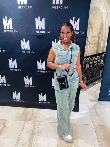 Reviewer showing a full-length view of the light-wash Sleeveless Denim Cargo Hoodie Jumpsuit.