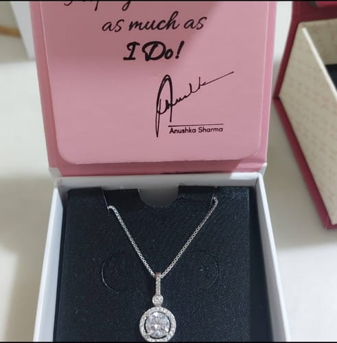 Customer's Silver Drizzle Drop Pendant with a circular zircon design, displayed in its box.