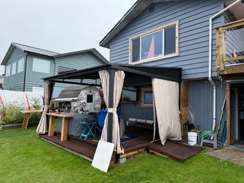 Customer photo review of SUNJOY 12x14 Metal Roof Lean to Gazebo, Wall Mounted Gazebo with Curtains and Netting