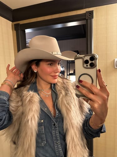 Reviewer's mirror selfie showcasing the M & Co. diamond stud earring.