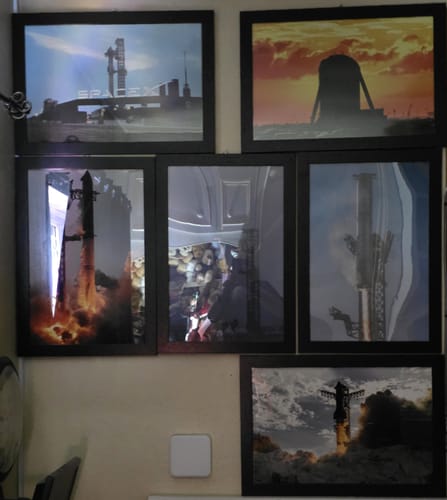 Customer's Golden Hour Hopper print, framed and displayed on a wall with five other space-themed art pieces.