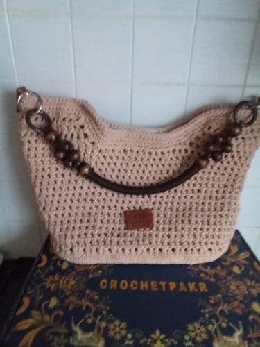 Customer's completed Sunny Beach Tote in a light beige color, featuring handles with dark wooden beads.