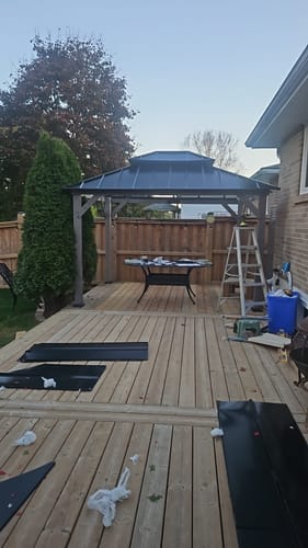 Customer photo review of SUNJOY 10x12 Outdoor Cedar Framed Wooden Gazebo with 2-tier Metal Roof and Ceiling Hook - Driftwood Cedar