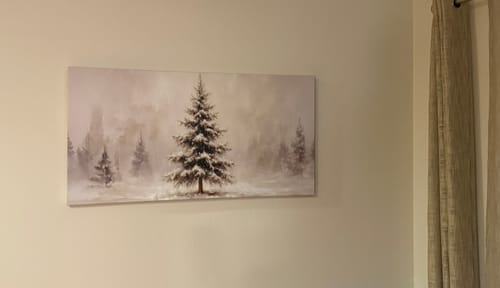Customer's Snowy Christmas Tree wall art hung on a light-colored wall in a room.