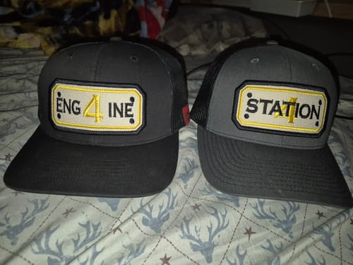 Customer's two customized SNAPBACK HOSE HATs, one for 'Engine 4' and one for 'Station 1'.