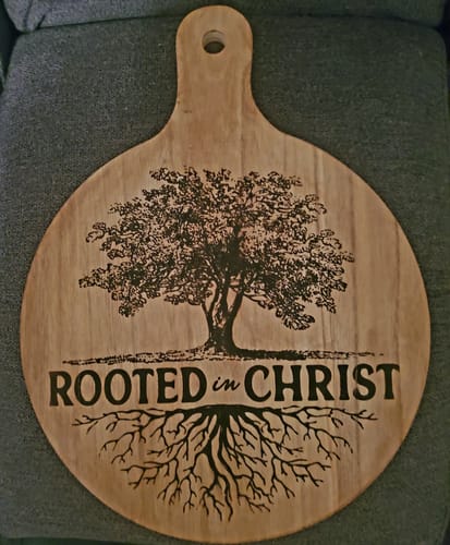 Customer's wooden cutting board decorated with a detailed tree design using Scorch Paint.