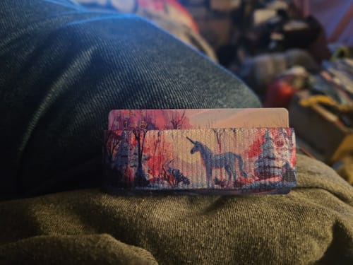 Reviewer's card holder from the Winter Wonders Collection, showing the 'Patronus' design with a unicorn in a forest.