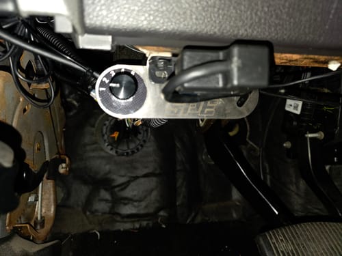Customer's SPE Motorsport Switch Bracket installed under a dashboard, holding a black 5-position dial switch.