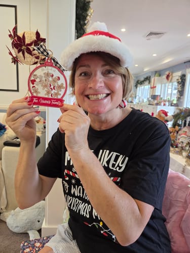 A happy customer who reviewed the Sea Cucumber Collagen Day & Night Pack, shown smiling in a festive setting.
