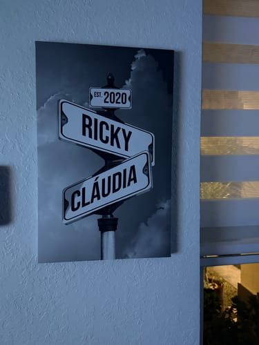 Customer's black-and-white 'Couples Date of Love' canvas with street signs for "Ricky," "Cláudia," and "Est. 2020" on a wall.
