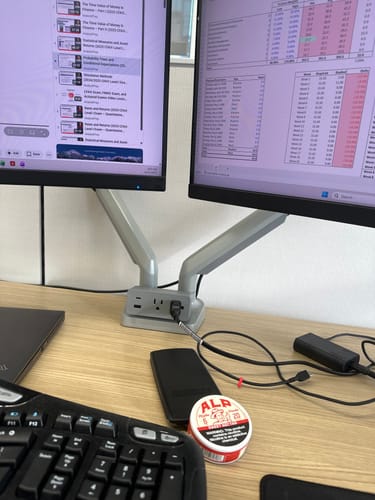 Customer's can of Sweet Nectar Nicotine Pouches on a desk next to a computer keyboard and monitors.