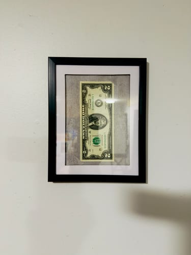 Customer's framed two-dollar bill, received as the 'Mystery Cash' from the TCG89 Mystery Cash Box.