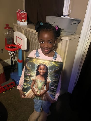 A customer smiling while holding her personalized 'The Frog Princess by the Pond' canvas portrait.