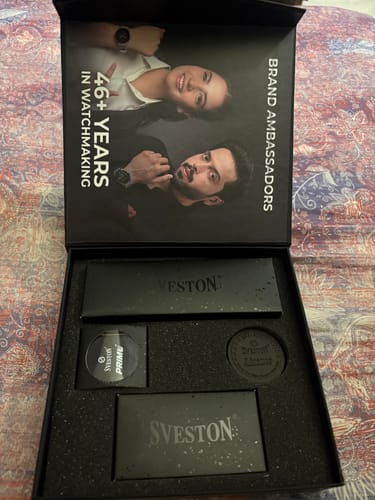 Packaging for the customer's Primo Smartwatch, displayed in a black presentation box.