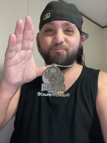 Reviewer showing a large Custom Photo Engraved Pendant Necklace with a detailed 'Dead Air Radio' logo.