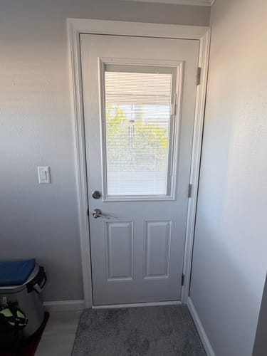 Customer's white interior door with the new Raise & Lower Blinds Glass and Frame Kit installed.