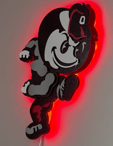 Customer's Ohio State Brutus Mascot 3D wall art mounted on a wall with red LED backlighting.
