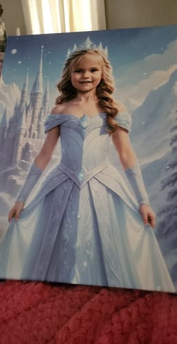 Customer's 'The Ice Princess' personalized portrait of a young girl in a beautiful blue gown with a snowy castle behind her.