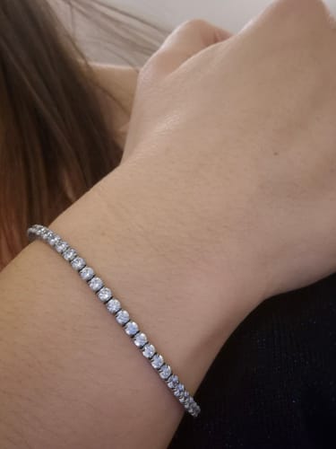 Close-up of a customer wearing the elegant Luxe Tennis Bracelet on their wrist.
