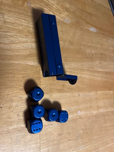 Customer's Blue 5pc D6 Set and its open case displayed on a wooden table.