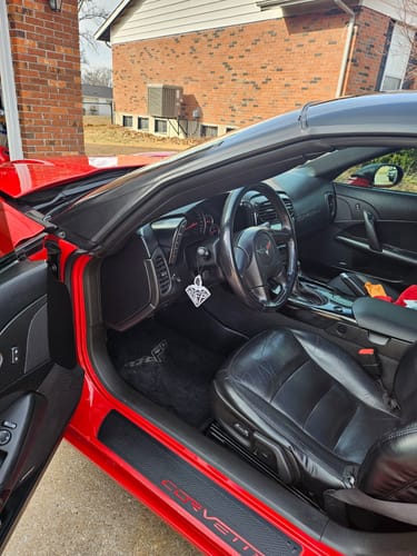 Customer's *LIMITED EDITION* AIR FRESHENER hanging from the steering column inside a red Corvette.