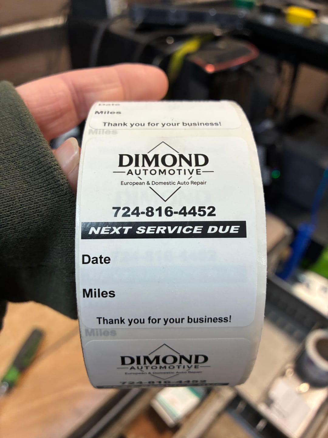 Customer photo review of Custom Oil Change Stickers for Windshield with Logo