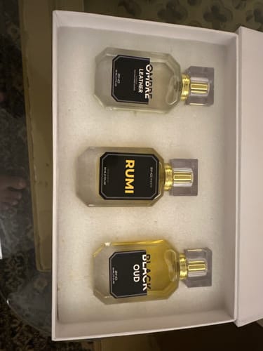 Customer's OUD Supreme BUNDLE showing three fragrance bottles in their open white presentation box.