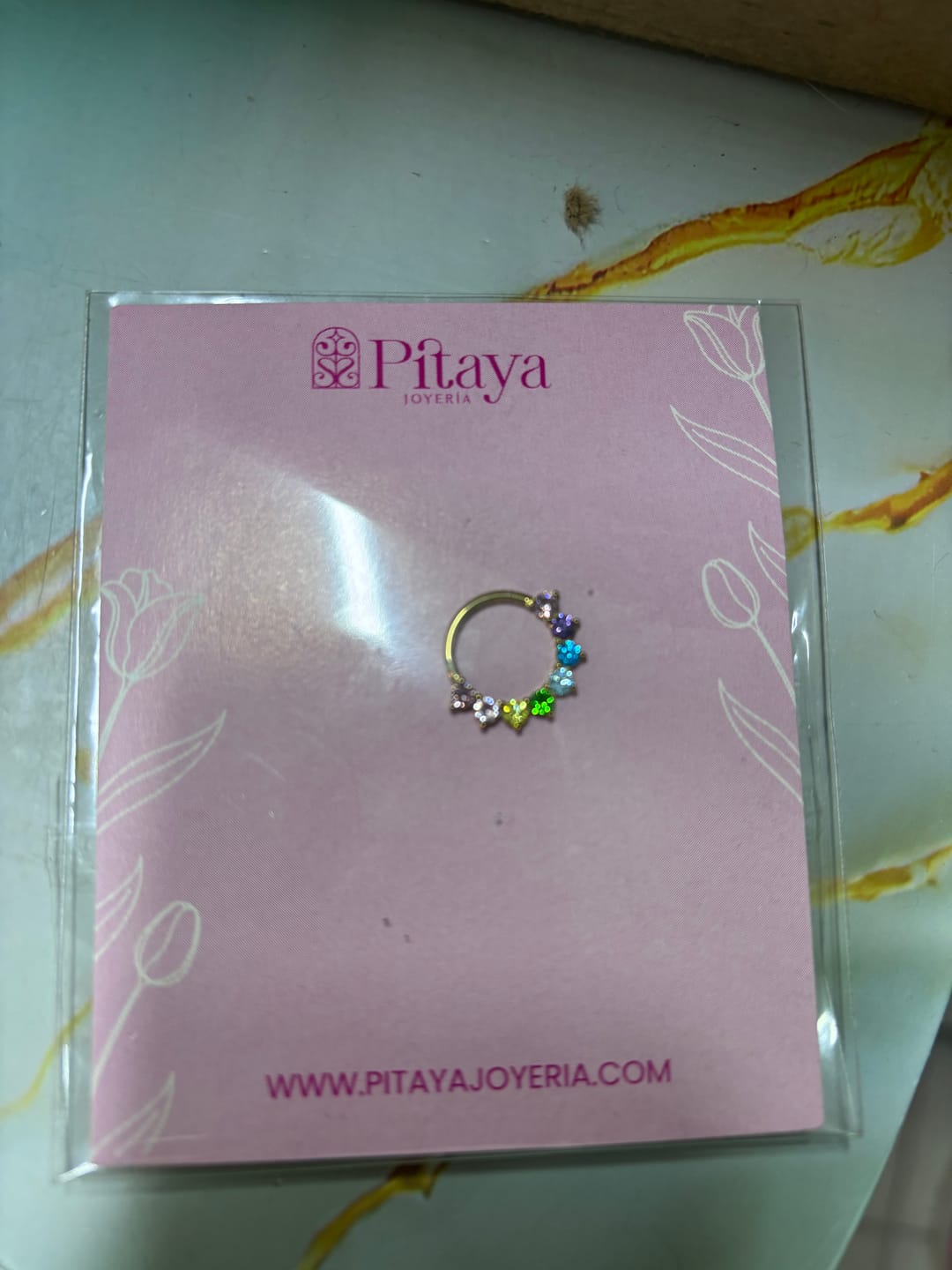 Customer photo review of Piercing Infinity con Zirconias Titanio