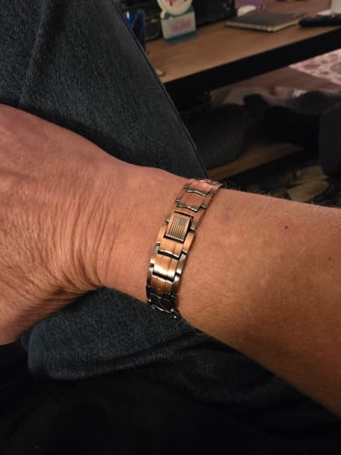 Reviewer wearing the two-tone Vitalis Copper Magnetic Bracelet on their wrist.