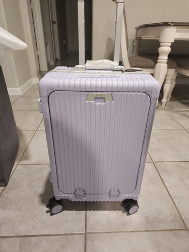 Customer's beautiful light purple All-in-One Carry-On standing upright with its handle extended.
