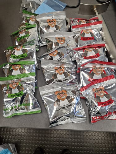 Customer's Pig 'n' Mix Box showing the various individual silver snack packets with red and green packaging.