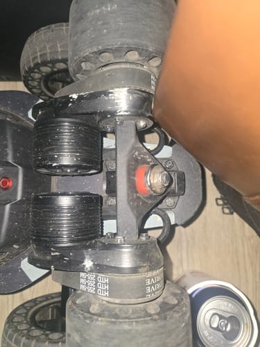 Close-up of a customer's installed black rear truck for the Voyager series on an electric skateboard.