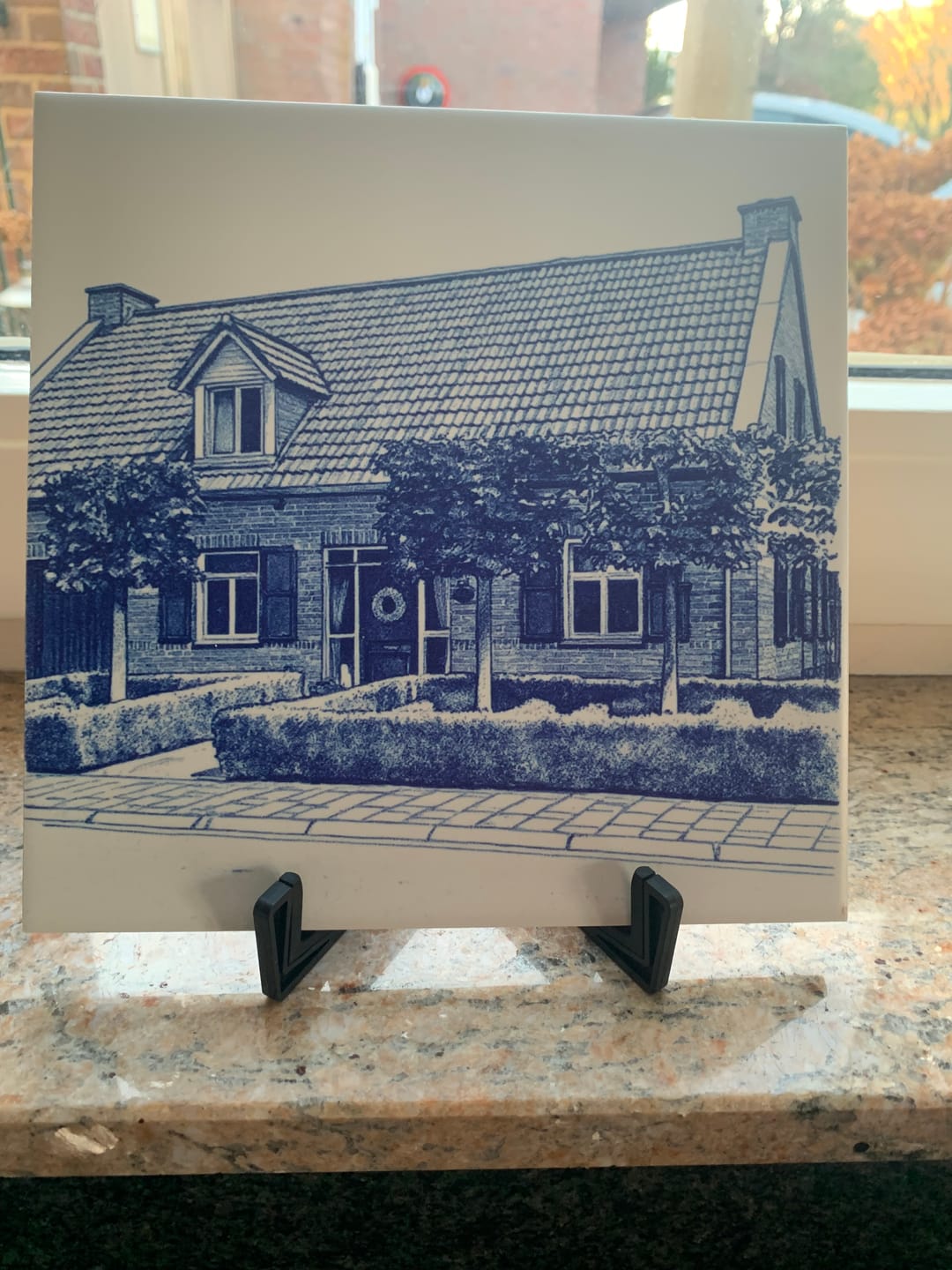Customer photo review of Delfts Blauw tegeltje bedrukken met eigen huis
