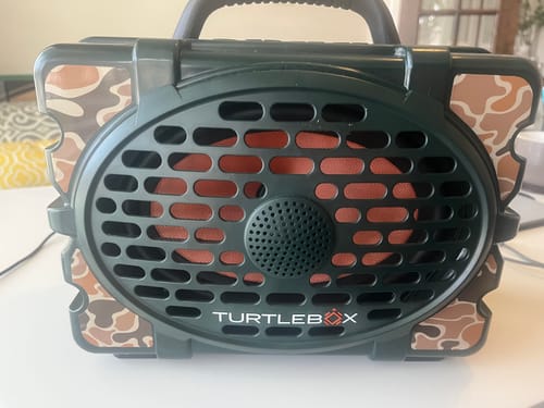 Customer's front view of a TurtleBox speaker with the camo TurtleBox Soga Skin applied around the grille.
