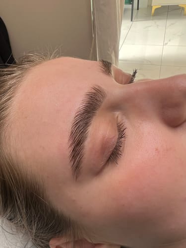 Reviewer with eye closed showing the brushed-up effect of the My Lamination eyebrow treatment.