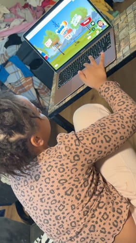 Reviewer's child using the K-5th grade educational program on a laptop