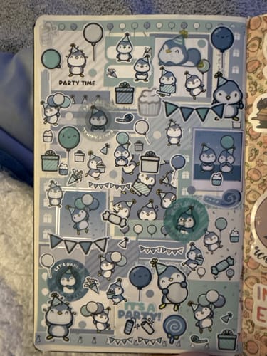 Customer's journal page showing a collage of cute Party Penguin stickers from the Ultimate Subscription.