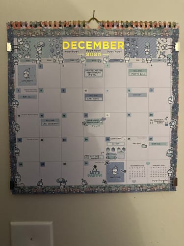 Reviewer's December calendar decorated with Party Penguin stickers and washi tape from the Ultimate Subscription.