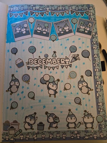Customer's December journal spread using cute Party Penguins stickers from the Ultimate Subscription.