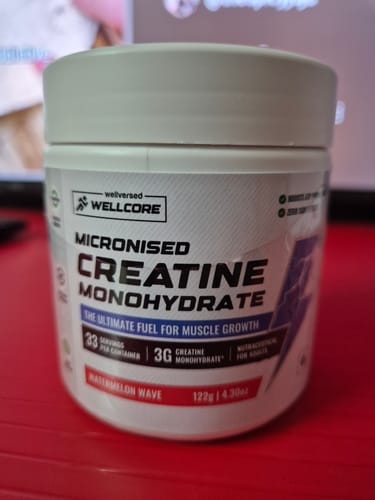 Customer's white tub of Wellcore Micronised Creatine Monohydrate in the Watermelon Wave flavor.
