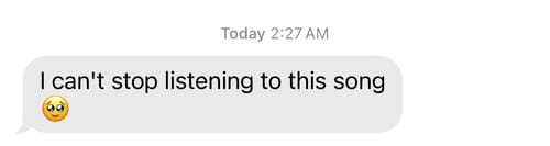 Customer's screenshot of a text message reaction to their custom song, reading "I can't stop listening to this song".