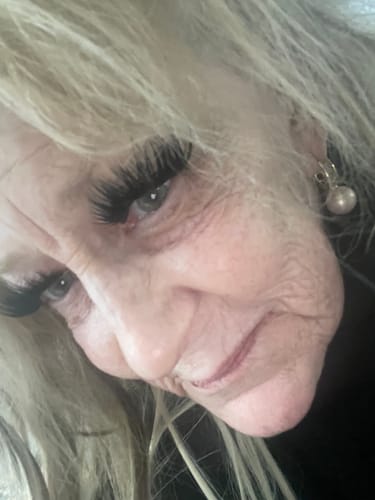 Close-up of a reviewer's eye, showing full lashes applied with the Whisper Light Bond.