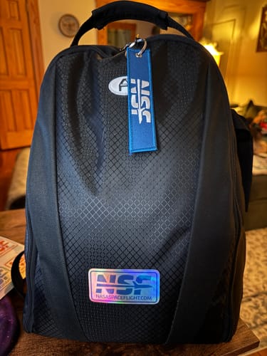 Customer's holographic NSF-Logo sticker from the sheet applied to a black backpack.