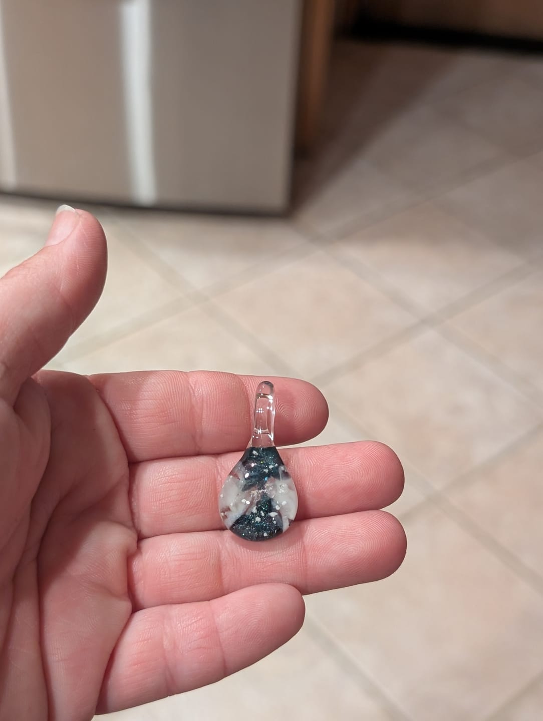 Customer photo review of Ocean Crash Pendant with Infused Cremation Ashes