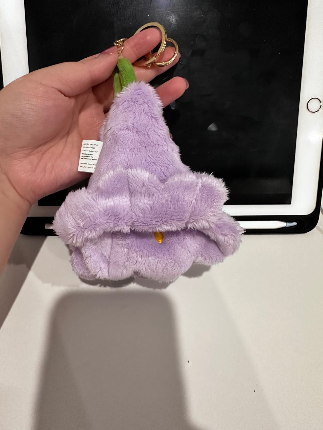 Customer photo review of UQ Jacaranda Plush Keyring